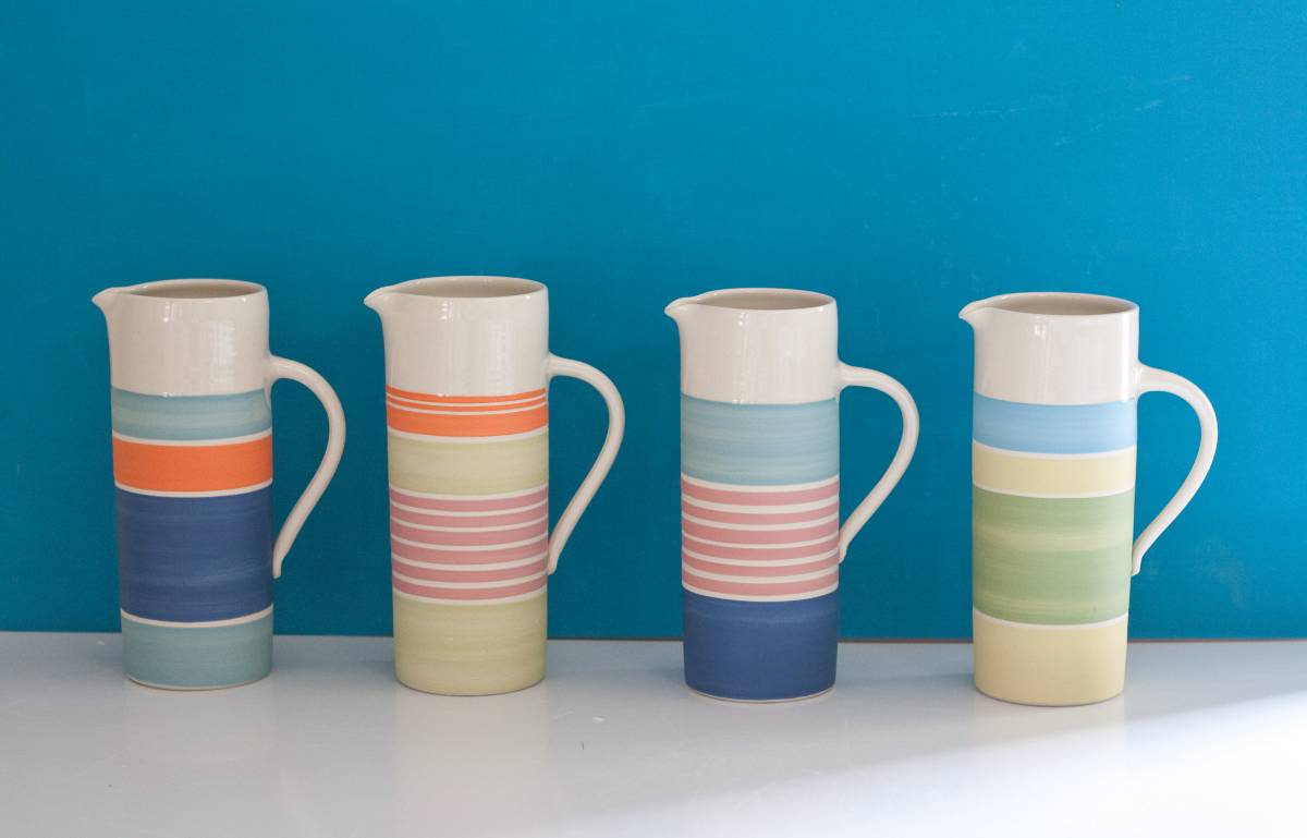 Tall jugs with bright bands of coloured slips